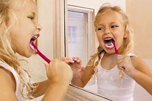 girl brushing teeth