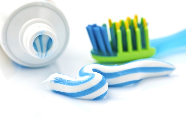 toothpaste with tube and toothbrush