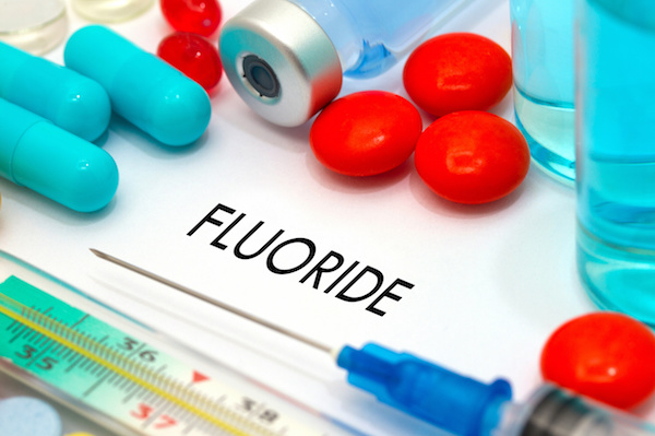 Fluoride. Treatment and prevention of disease. Syringe and vaccine. Medical concept. Selective focus