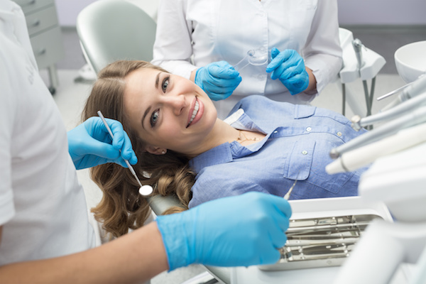 Dentist examining a patient's teeth in the dentist.