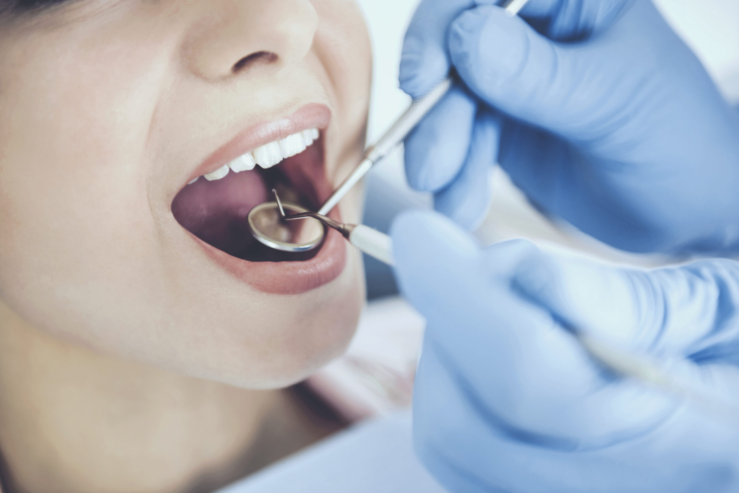 dental hygienist Doctor in Rubber Gloves. Examine Teeth of Patient. Closeup Checking Condition of Mouth. Healthcare Concept. Medicine and Care. Treatment at Dentist Office. Medical Treatment. Dental Hygiene.